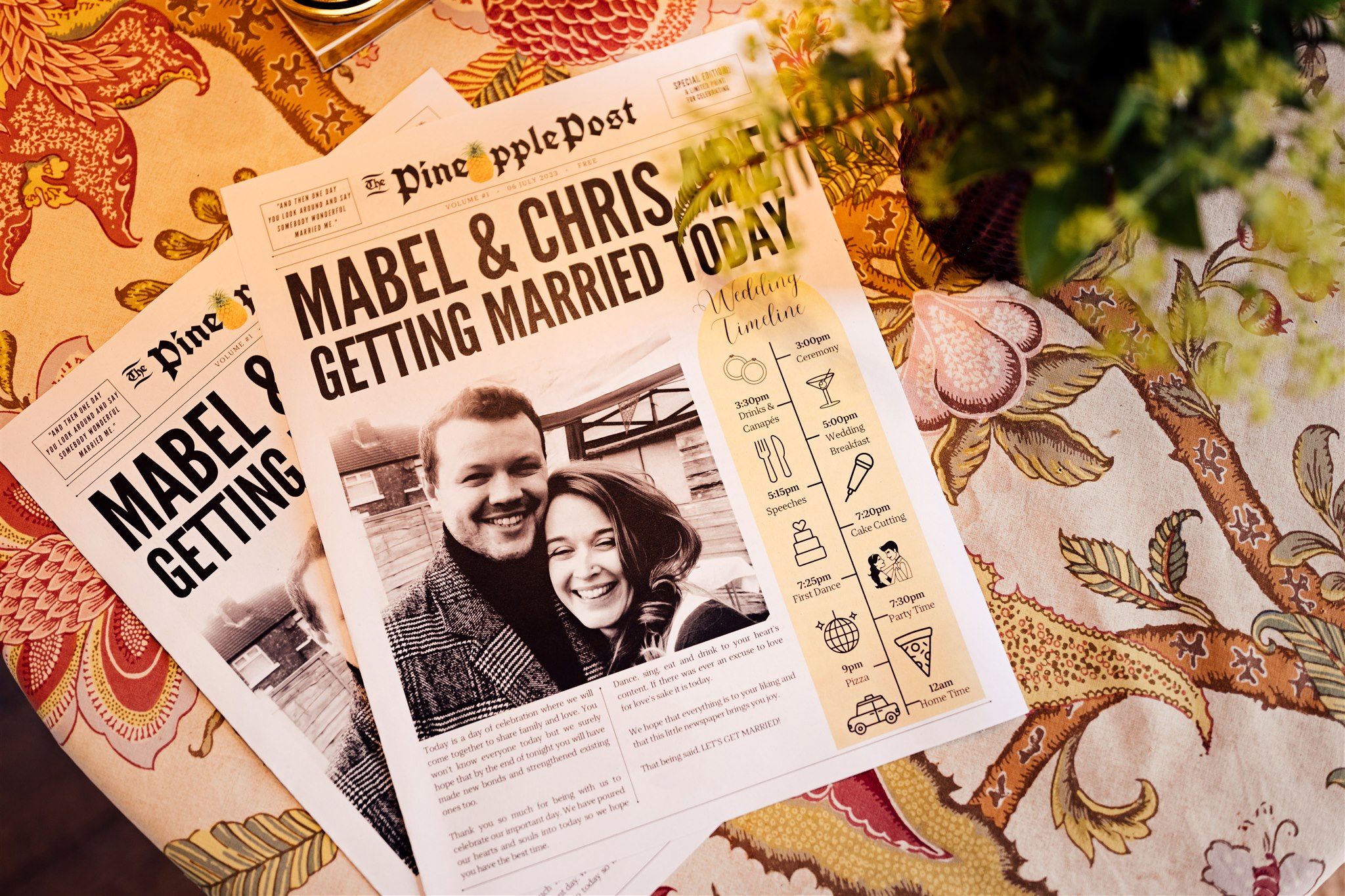 A newspaper made especially for a couple's wedding at Iscoyd Park with black and white photos, timelines and text in it.