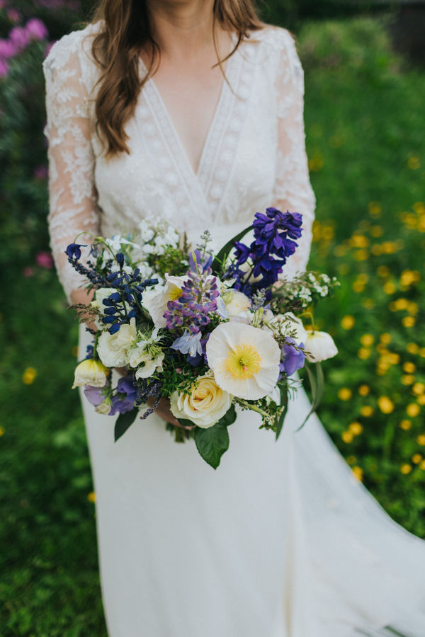 A blue and purple themed English country wedding with a Laure de Sagazan wedding dress and eau de nil bridesmaid dresses by Lisa Webb Photography