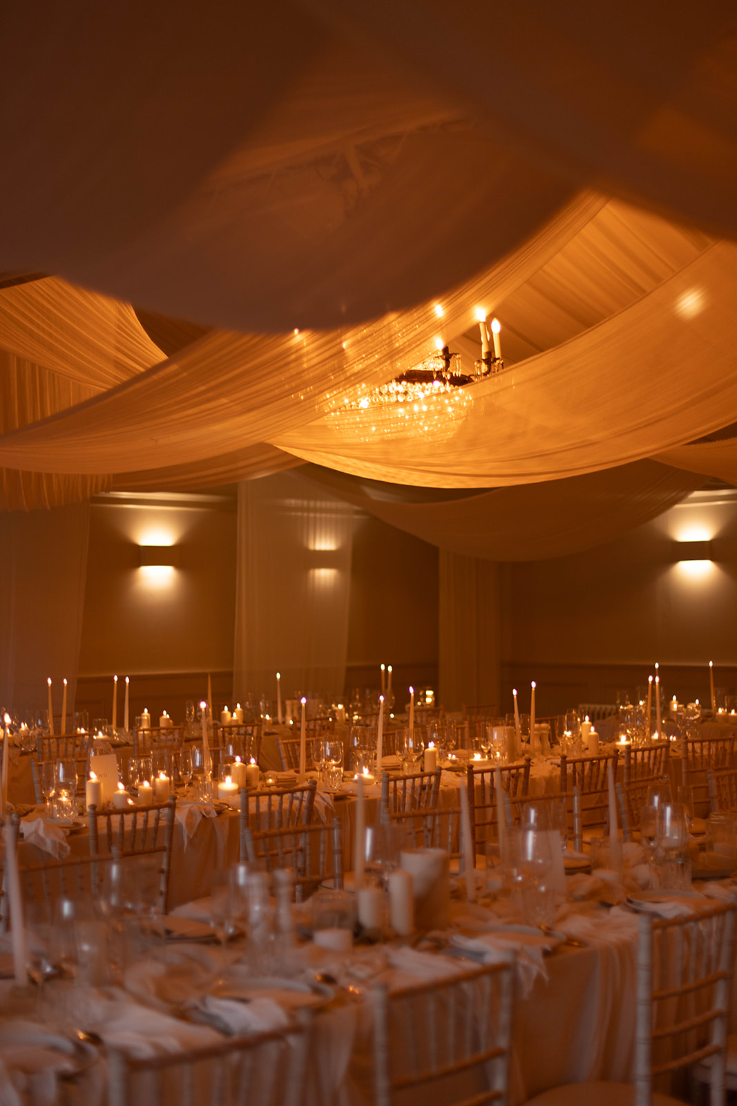 Fabric draping and candles for your winter wedding marquee reception at Iscoyd Park by Emmylou Kelly Photography