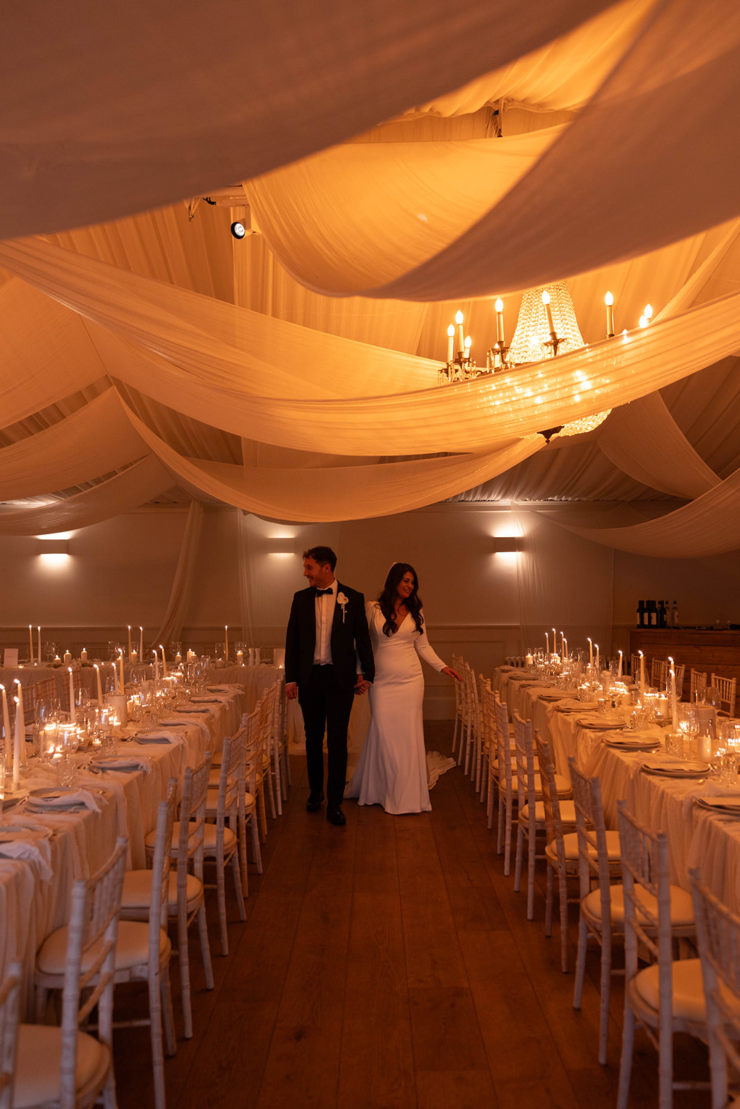 Fabric draping and candles for your winter wedding marquee reception at Iscoyd Park by Emmylou Kelly Photography