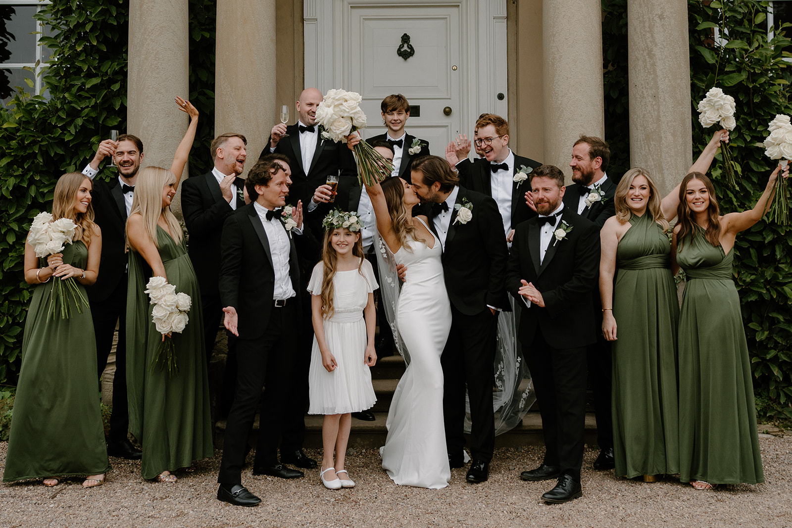 A quintessentially English summer wedding at luxury wedding venue Iscoyd Park with a green, black and white colour scheme, black tie and two wedding dresses photographed by Rebecca Kerr Photography.