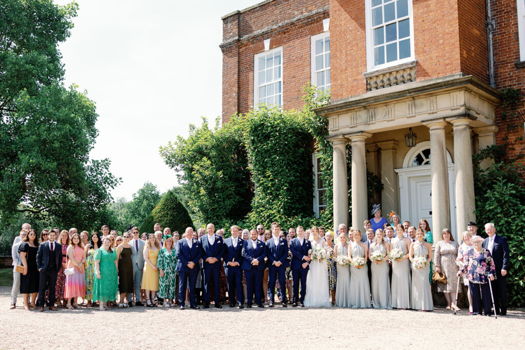 A dreamy romantic blush pink English Summer wedding with champagne tower at luxury venue Iscoyd Park by Jade Osborne Photography