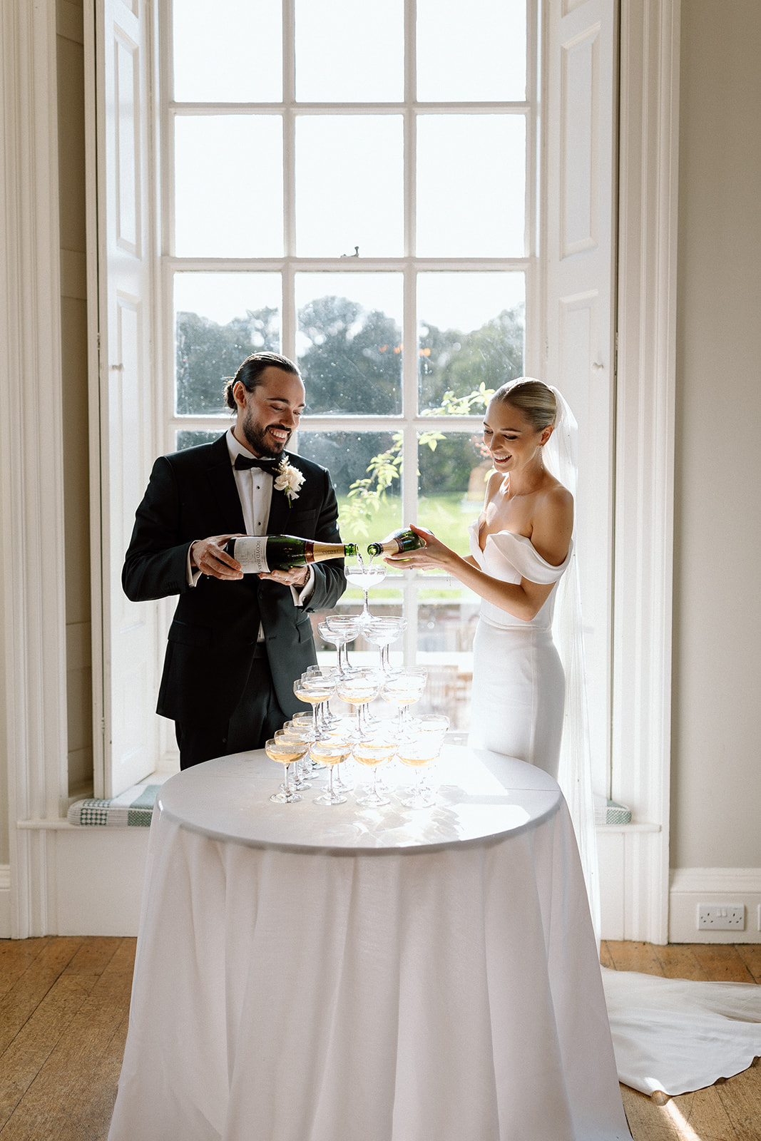 Your complete guide on how to build the best wedding champagne tower for your big day including flower ice cubes inspiration at Iscoyd Park