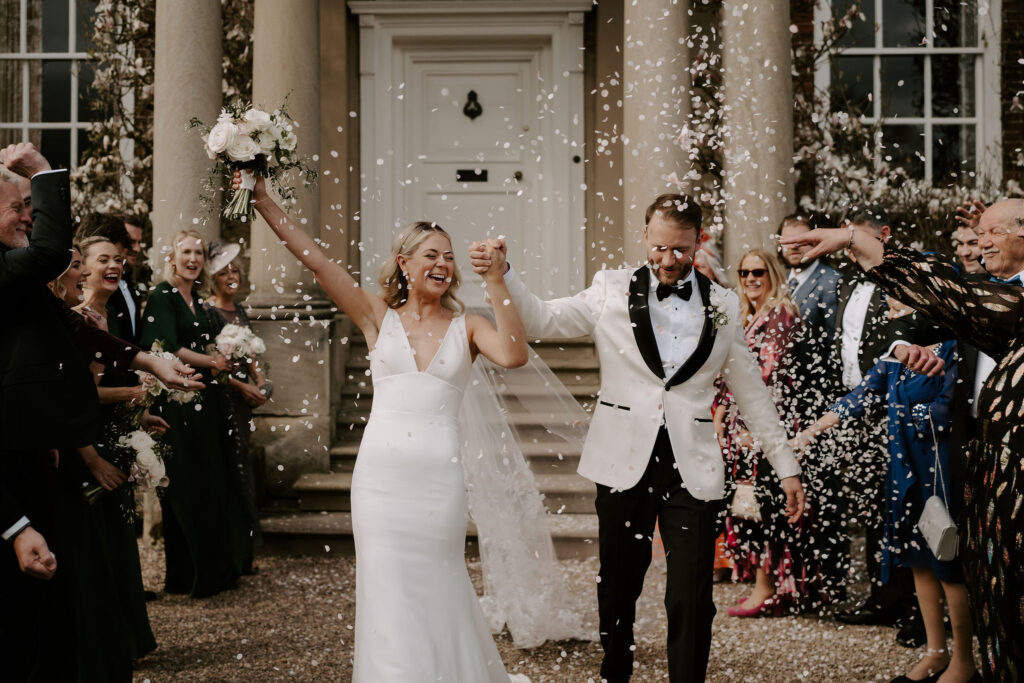 An early Spring black tie wedding at Iscoyd Park with a Caroline Castigliano dress and blush pink theme by Lauren Juliette Photography