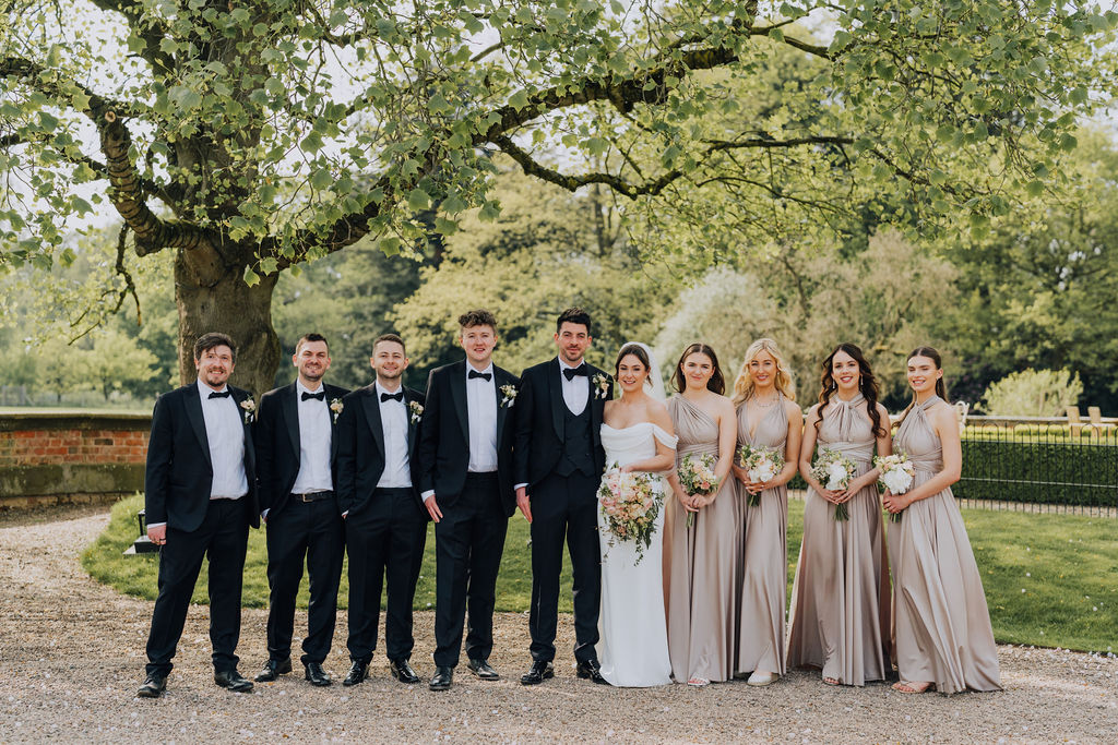 May classic English wedding at luxury venue Iscoyd Park with black tie, blush and champagne bridesmaids dresses by Clara Cooper Photography