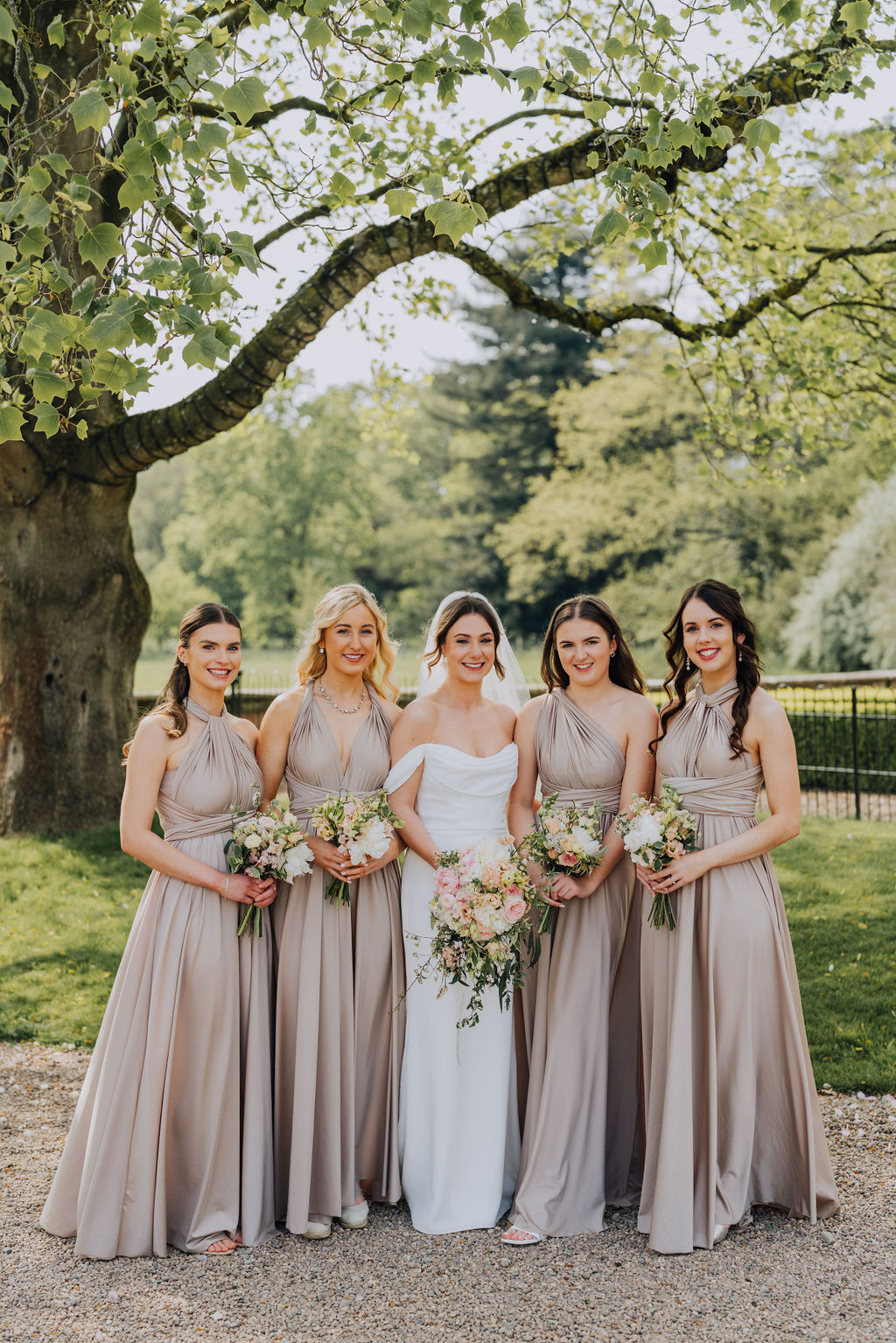 May classic English wedding at luxury venue Iscoyd Park with black tie, blush and champagne bridesmaids dresses by Clara Cooper Photography