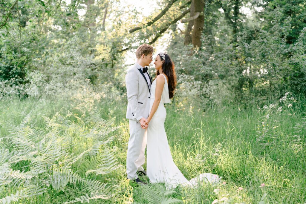 Green and white themed Spring Iscoyd Park wedding with a cowl back bridal gown, a first look and sequin backdrop by Tobiah Tayo Photography