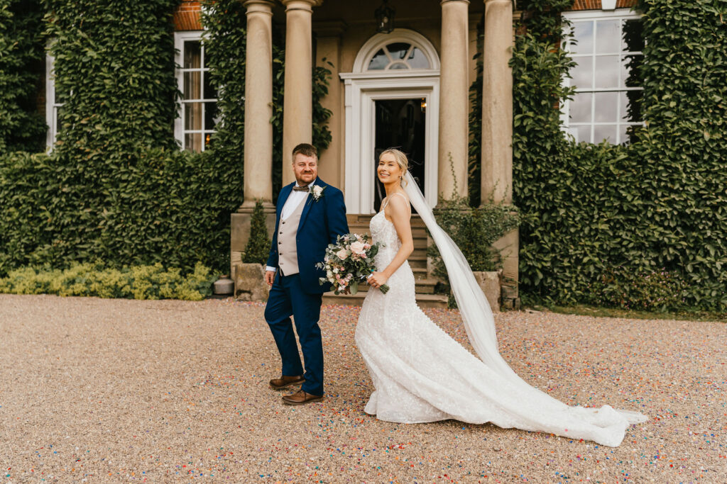 A blush pink rose Summer wedding at luxury wedding venue Iscoyd Park with beaded backless wedding gown by Jessica Hopwood Photography.