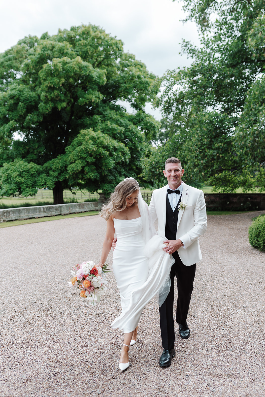 Check out this colour pop modern luxe wedding with coral florals at Iscoyd Park by Lucy Henzell Photography