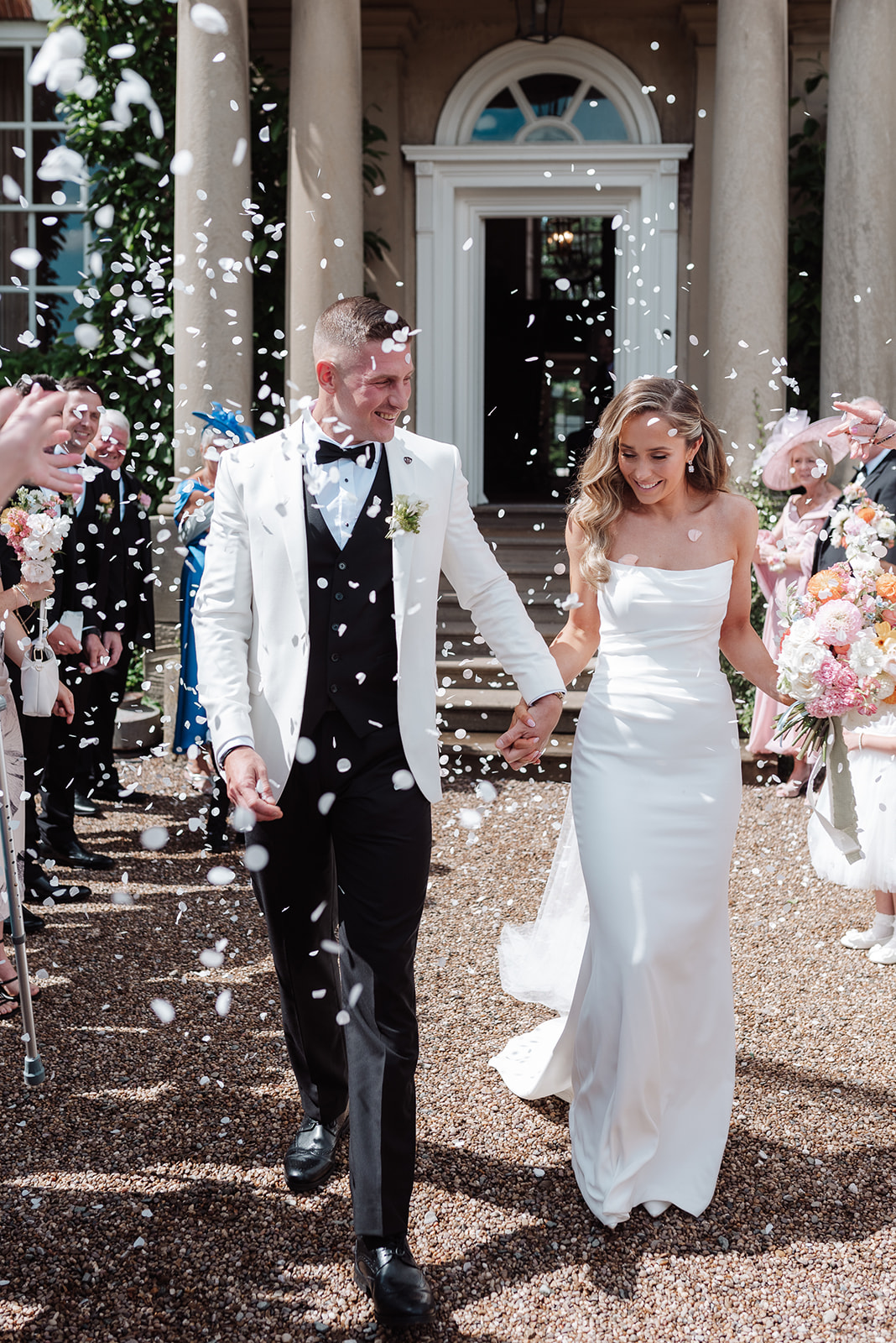 Check out this colour pop modern luxe wedding with coral florals at Iscoyd Park by Lucy Henzell Photography