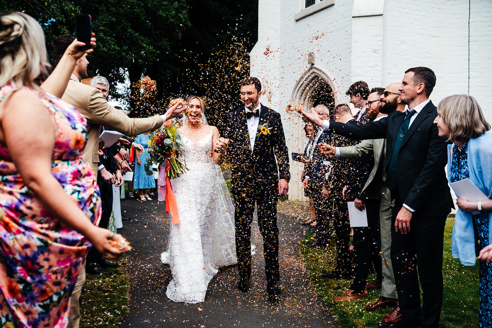 Colour pop juicy fruit wedding at luxury UK venue Iscoyd Park by Hannah Hall Photography.