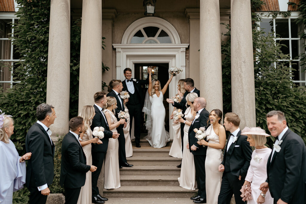Modern Luxe Spring wedding at luxury venue Iscoyd Park with oyster bridesmaid dresses, white orchids blush roses by Lauren Stacey Photography